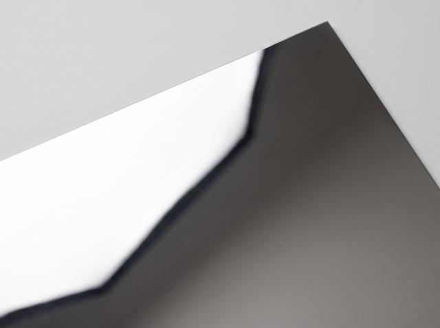 Mirror-polished metal paper swatch — reflective silver