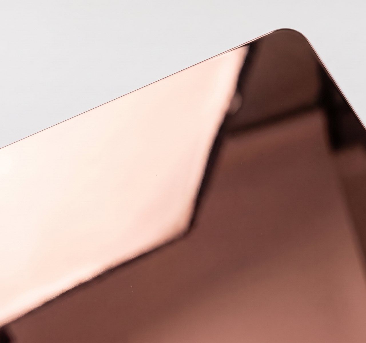 Mirror-polished rose gold metal, reflective rose gold paper swatch