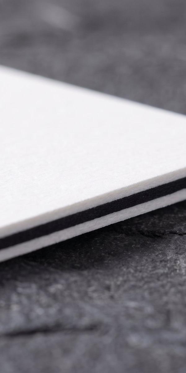 Triplex white / black / white paper swatch: cream with black core