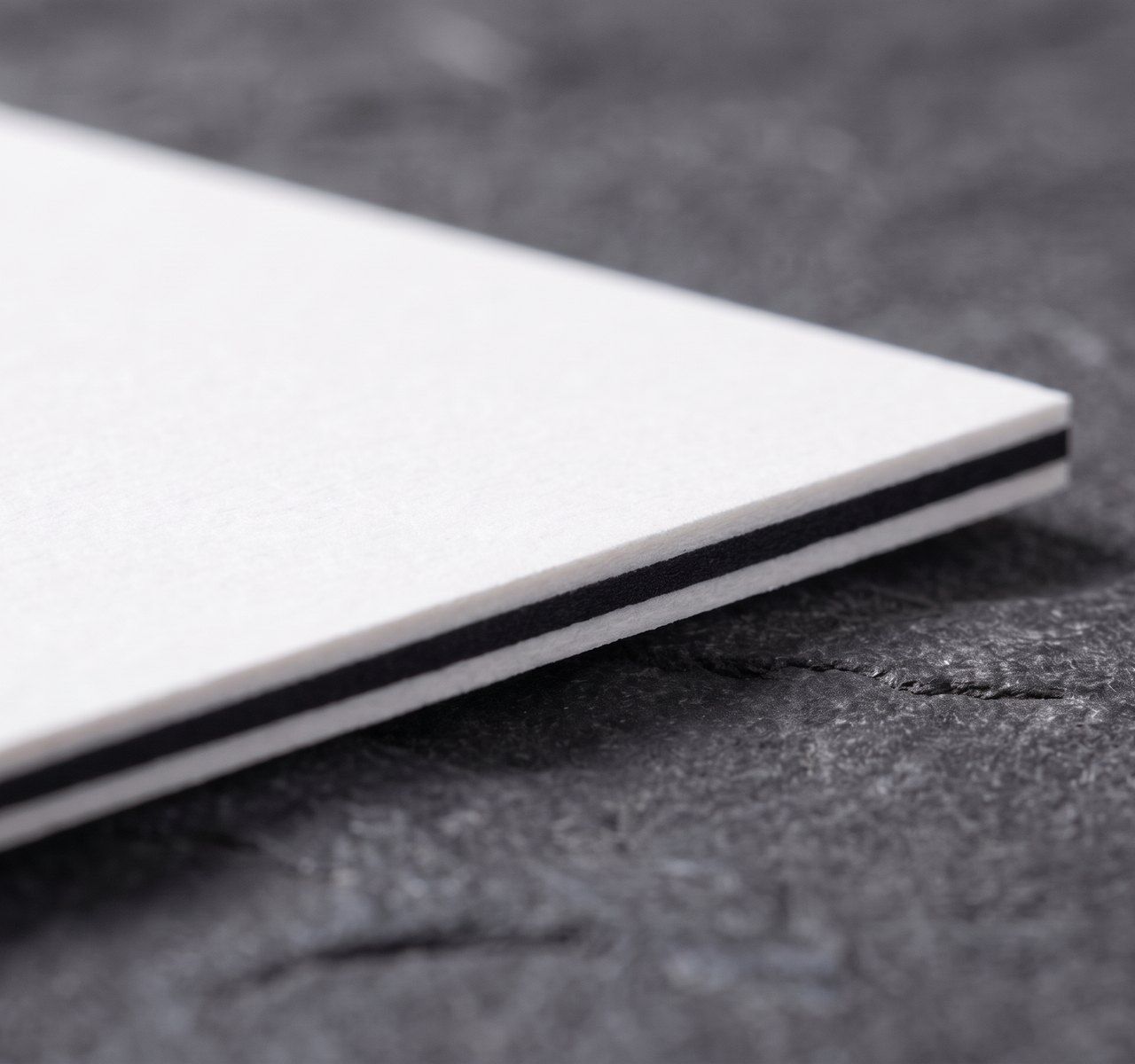 Triplex white / black / white, cream with black core paper swatch
