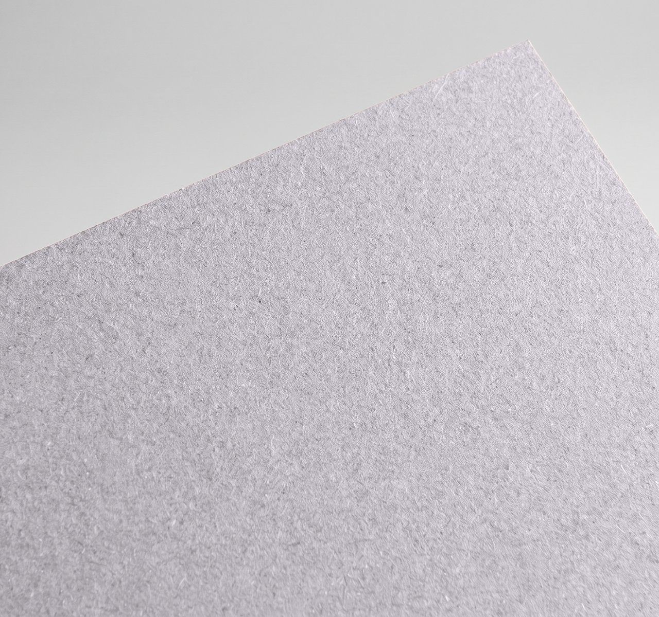Gmund Les Naturals Galet, Galet, Rough, toothy recycled board with natural multicoloured inclusions paper swatch