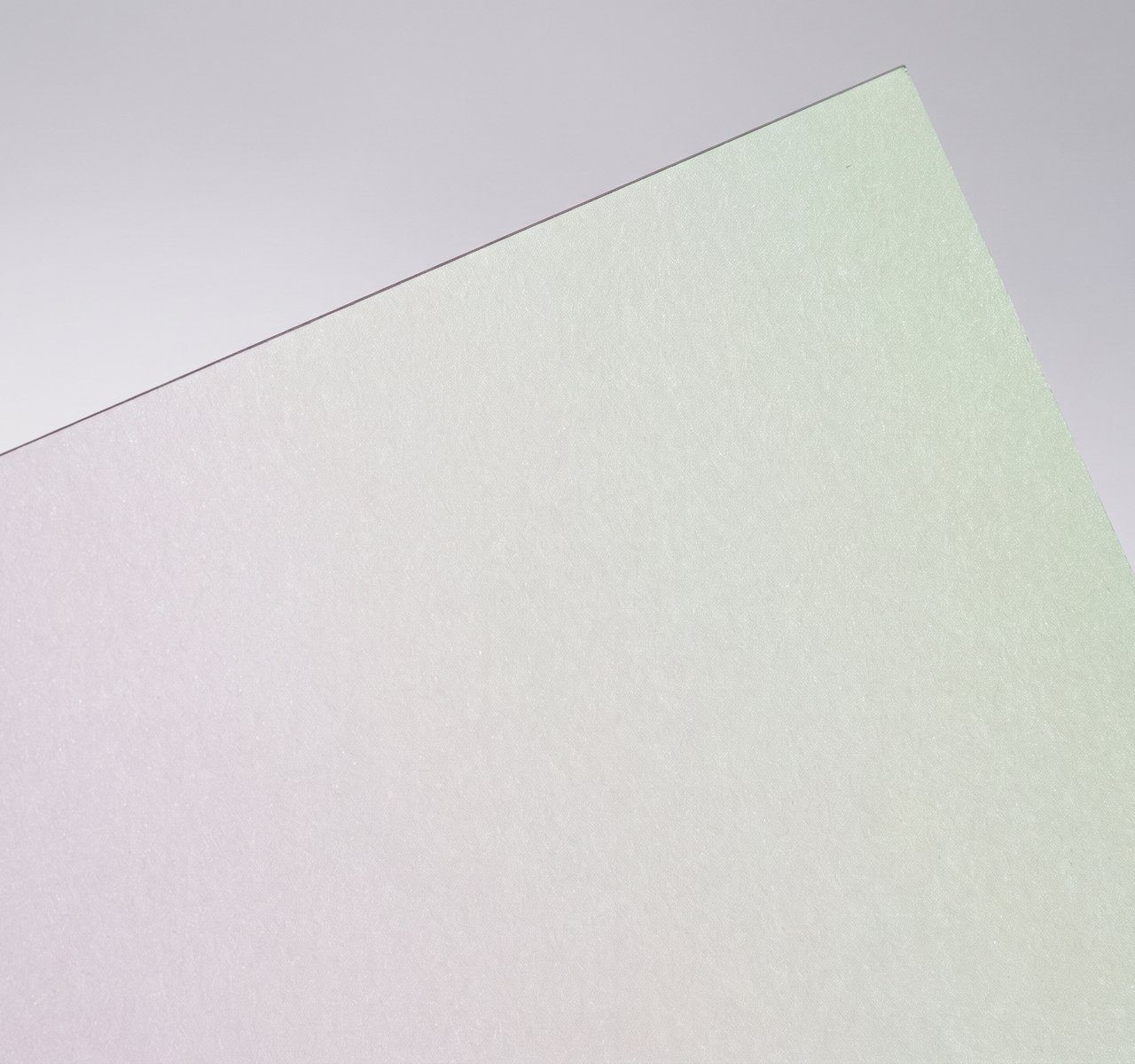 Sirio Illusion Biancoverde, Biancoverde, pulp-dyed base with an iridescent, embossed finish on one side; colour flips between two tones with viewing angle (names pair the two tones, e.g. Rosa+Malva) paper swatch