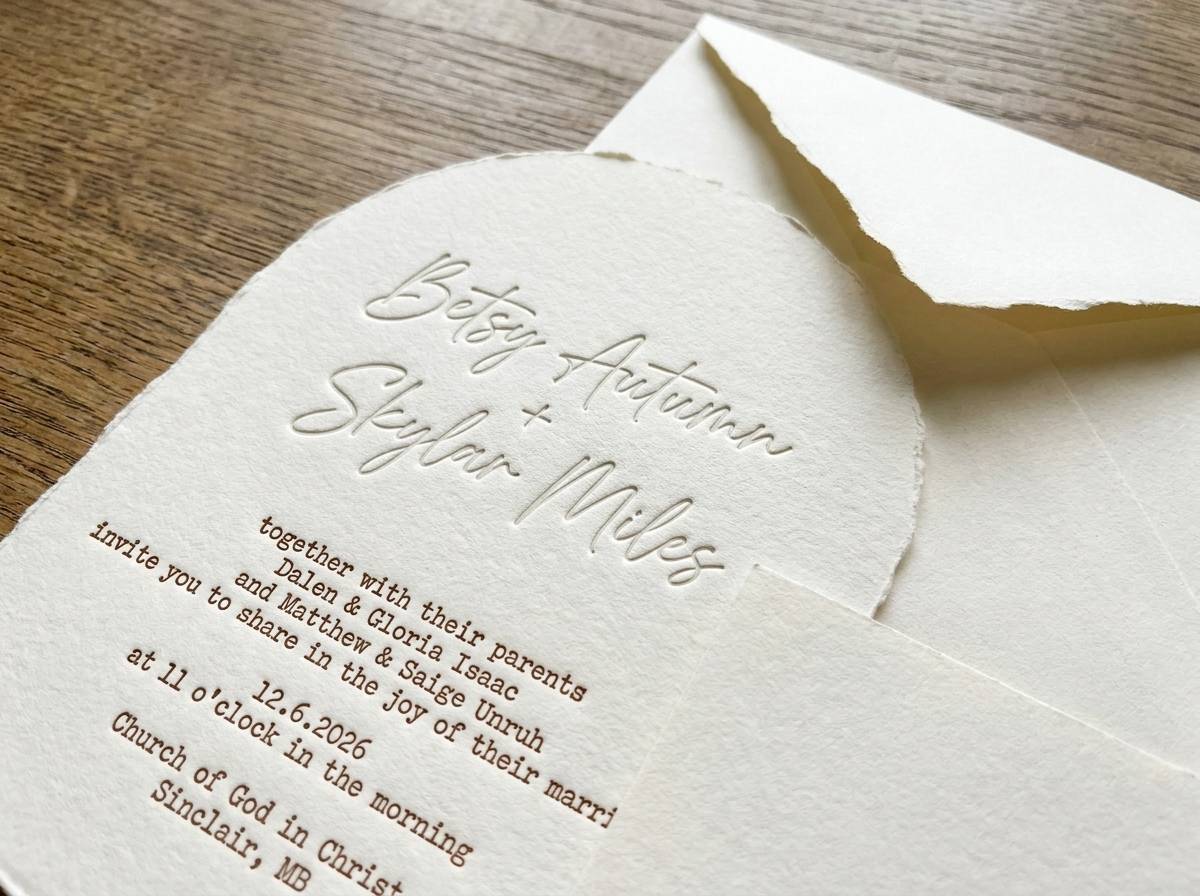 Blind Arch with Typewriter Emboss concept: Mohawk Via 110lb cream handmade · Arch die-cut · Ripped edge