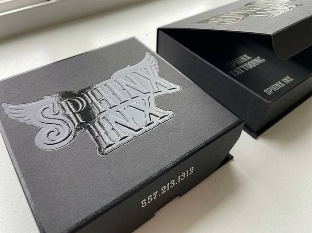 Raised Black Steel concept: 110lb black cotton · emboss, die-cut, gloss varnish, satin silver foil