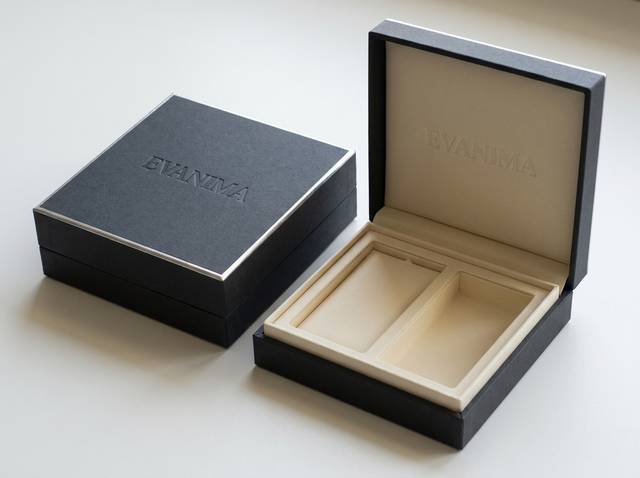 The Minimalist Archive concept: Charcoal uncoated matte (exterior); warm ivory uncoated matte (interior) · Blind deboss logo · Silver foil edge (top)